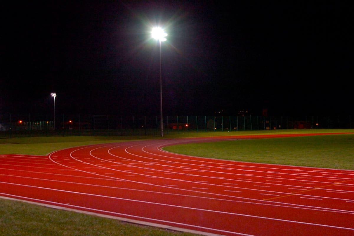 St Matthew's athletics track floodlit at night