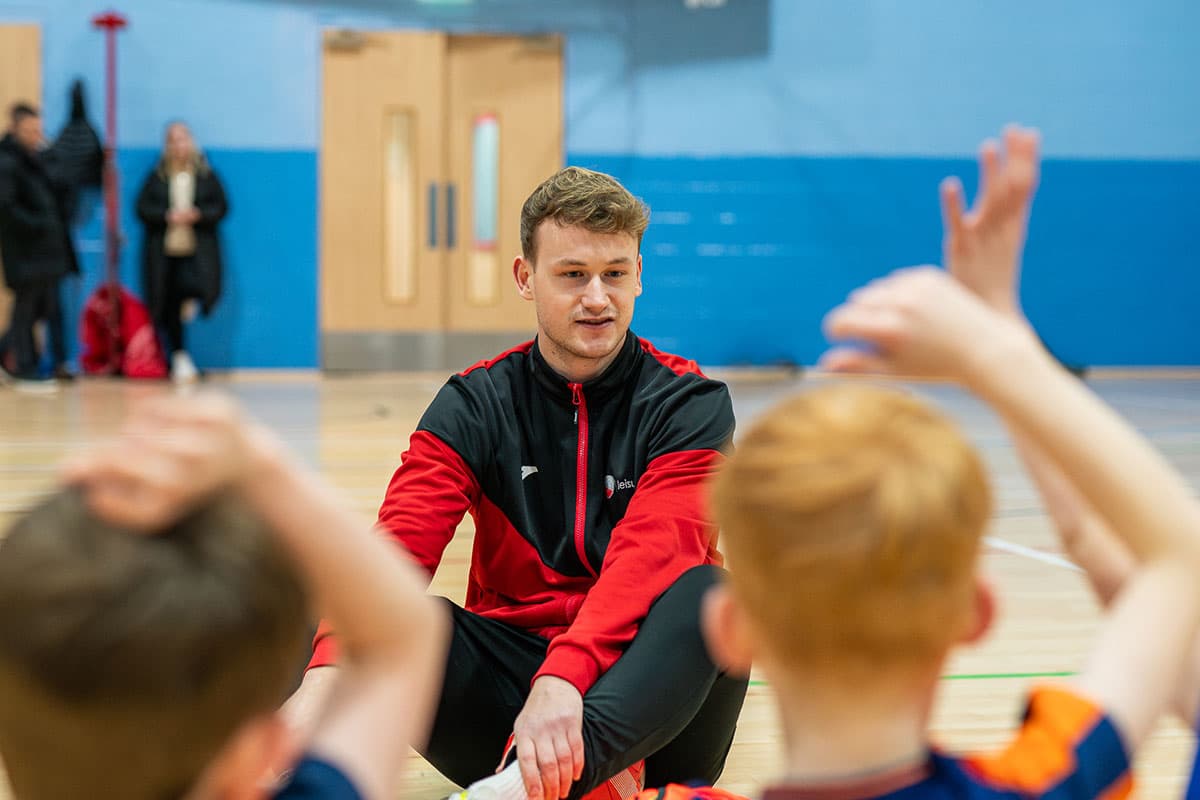 Coach teaching children