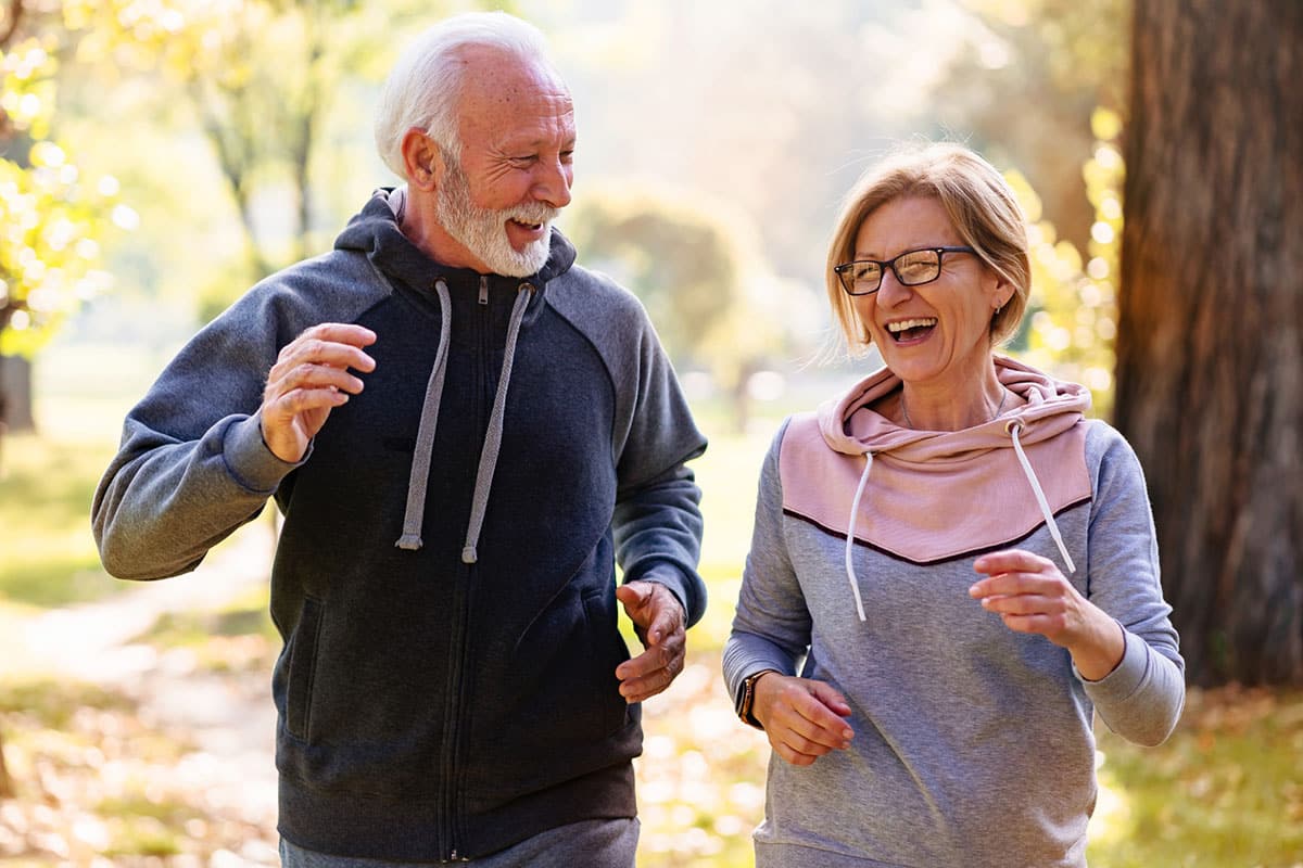 A senior couple enjoying a jog in the park
