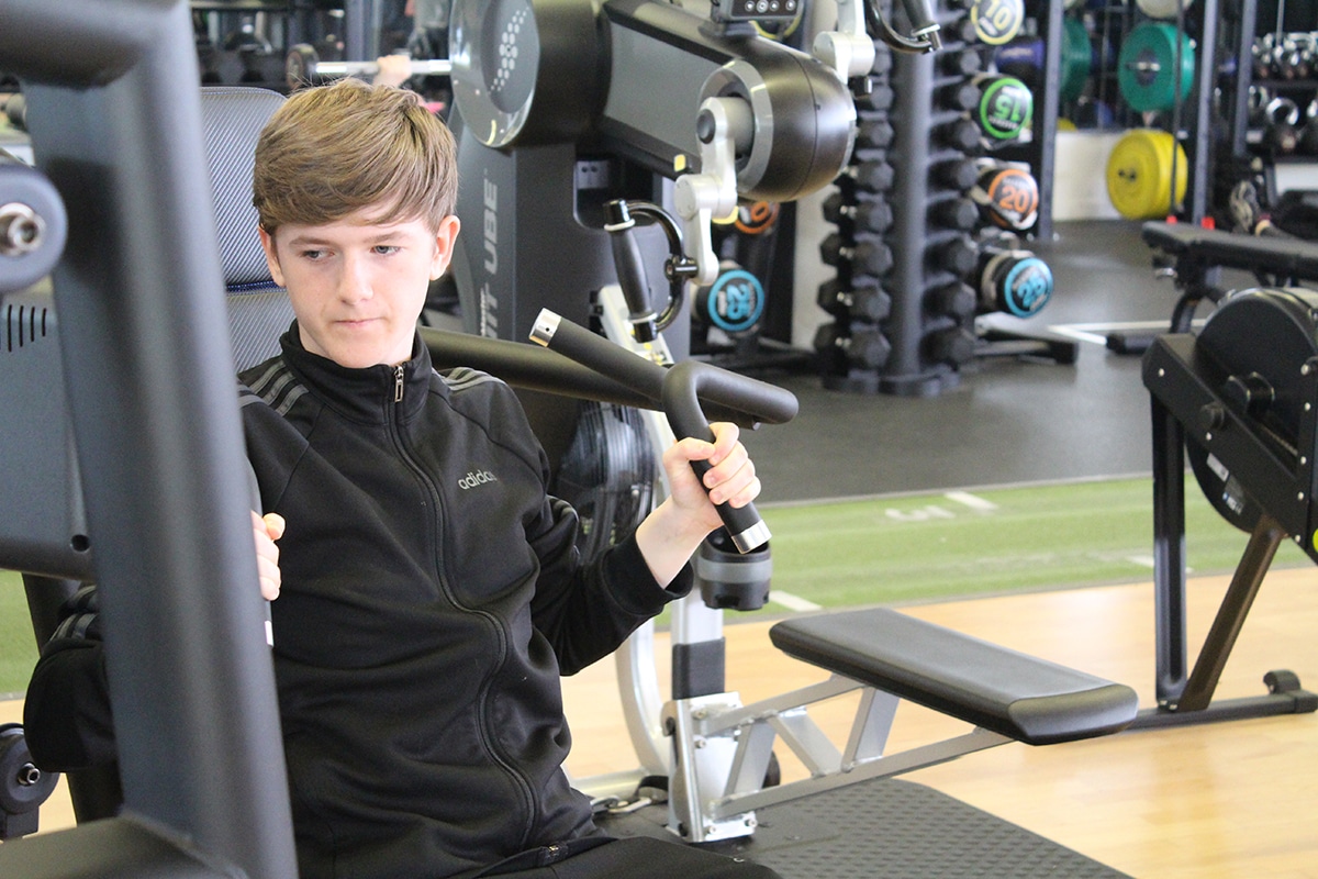 Teenager using equipment at Elevate Academy
