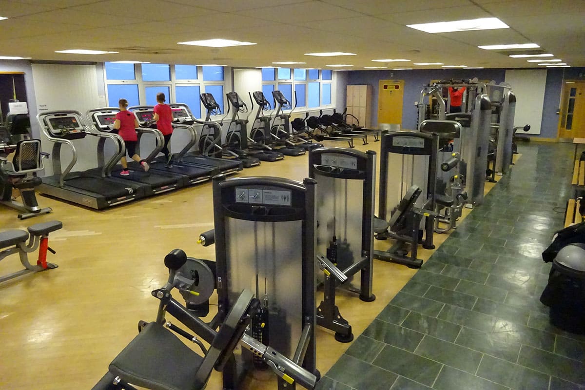 Women running on treadmills in gym