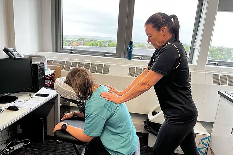 Women giving Seated Acupressure