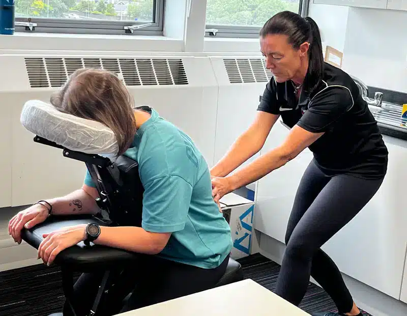 Women giving Seated Acupressure