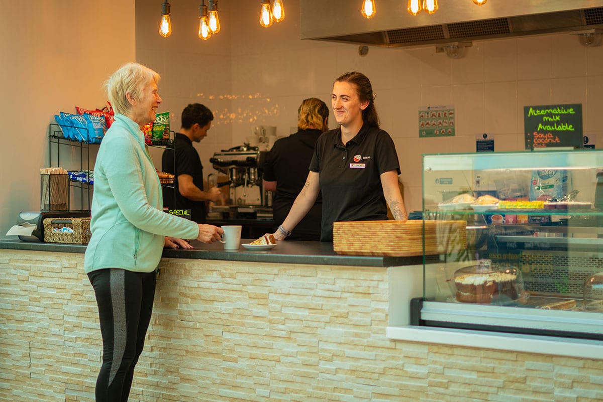 Woman getting a coffee at Vikingar! cafe