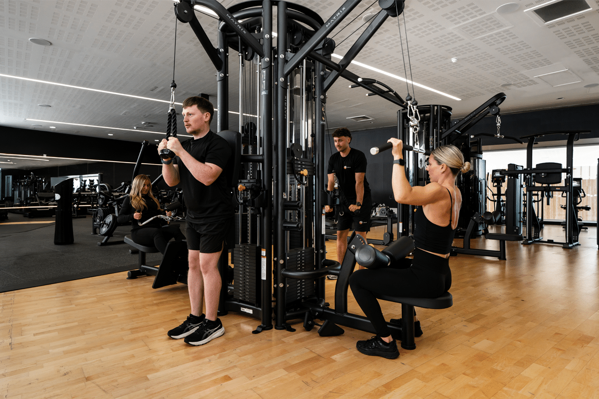 gym-portal-resistance People using pin loaded equipment