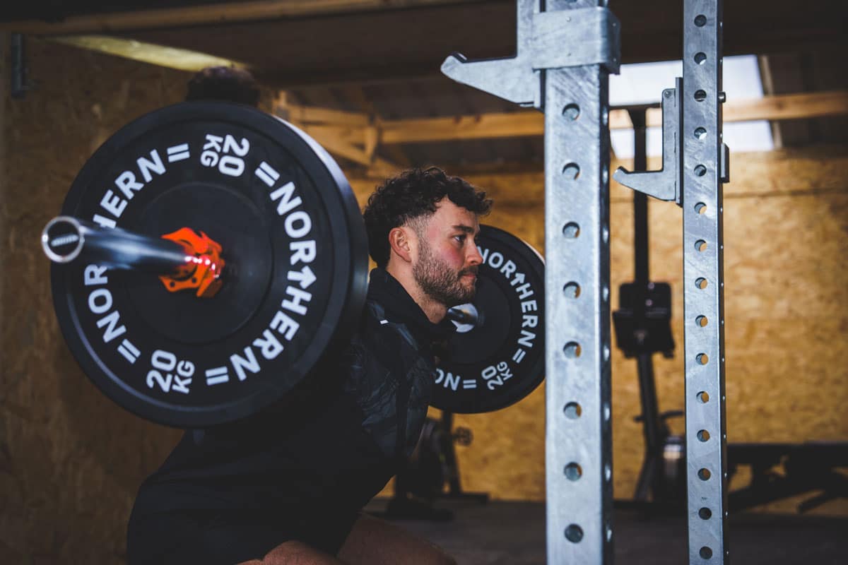 portal gym3 Man doing weighted squat in outdoor rack